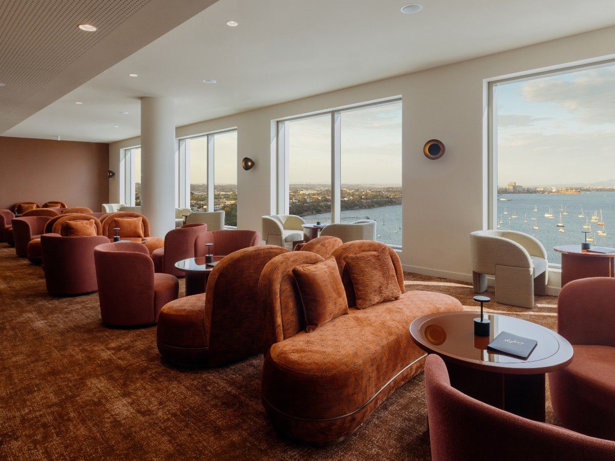 Cozy lounge with waterfront views and seating.