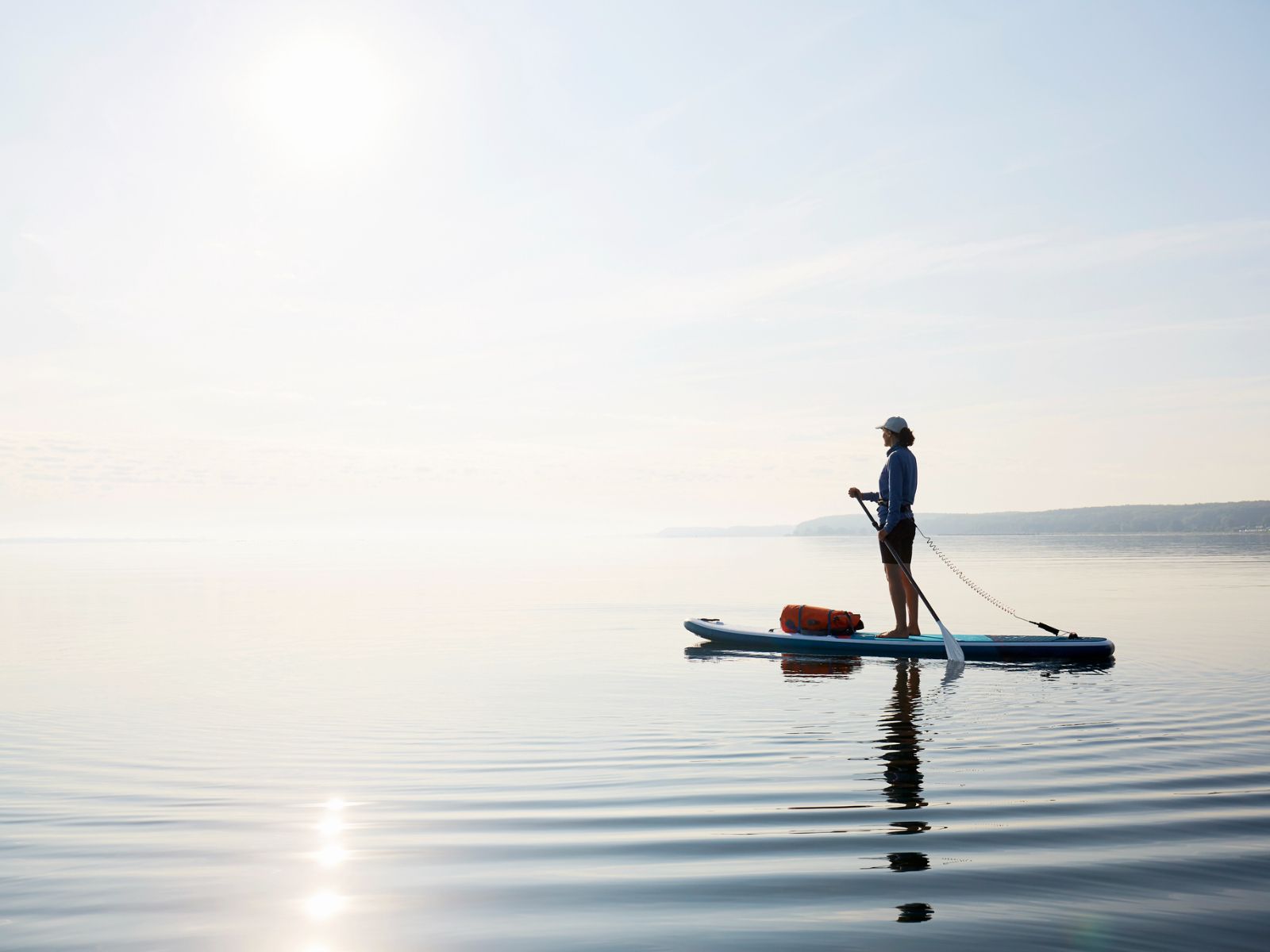 Stand-up paddleboarding on calm waters