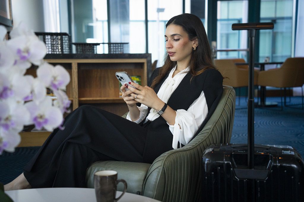 Woman sitting in chair at InterContinental San Francisco Club Lounge