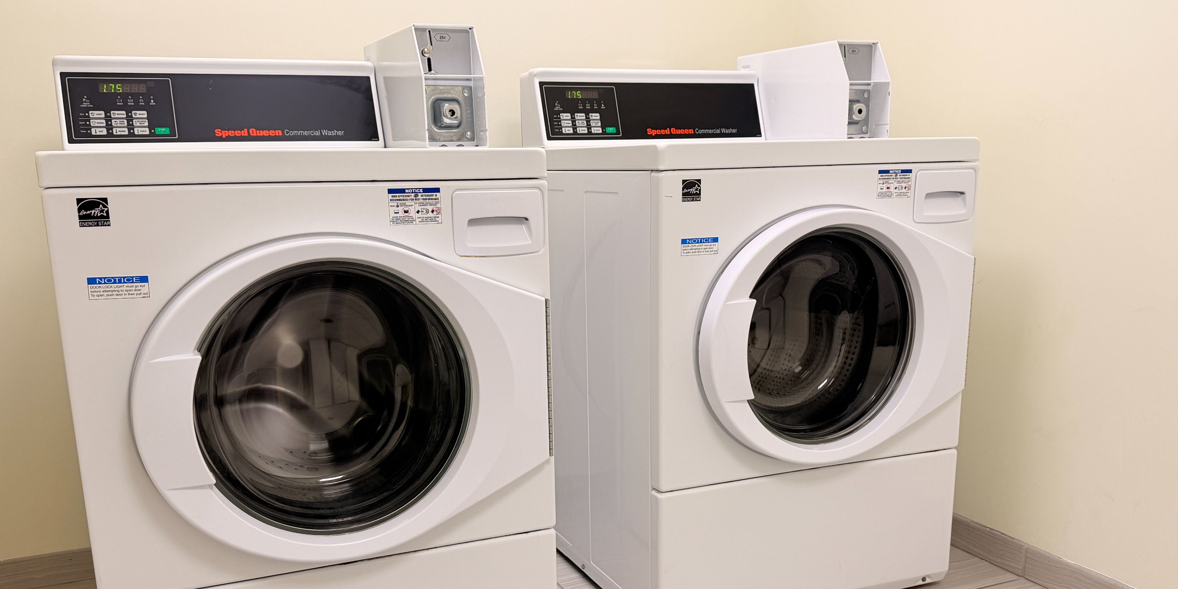 Washer and dryer in a laundry room at the hotel.