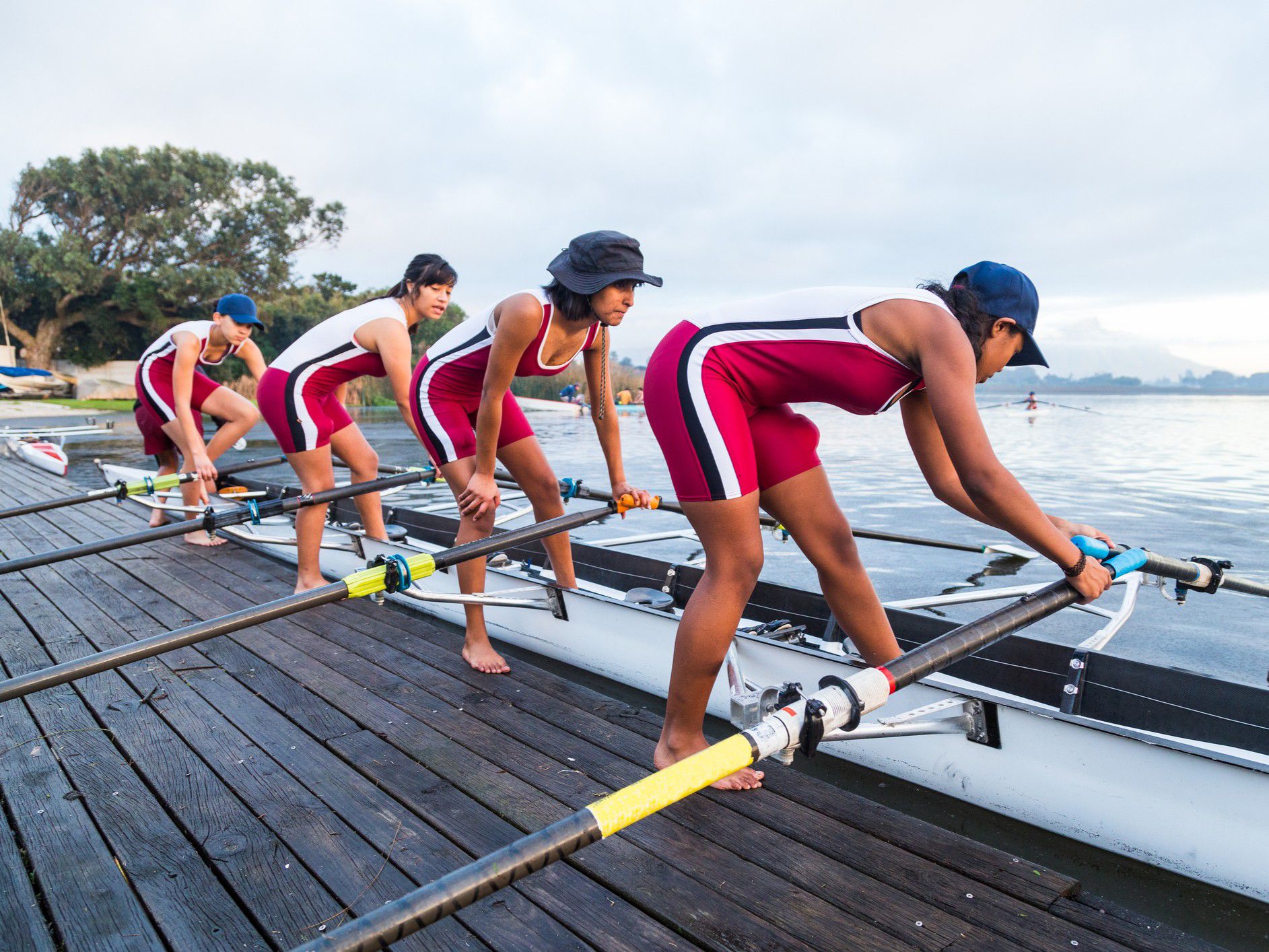 All female row team setting up for training