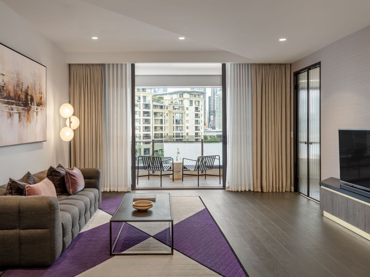 Spacious hotel suite with lounge area and bedroom
