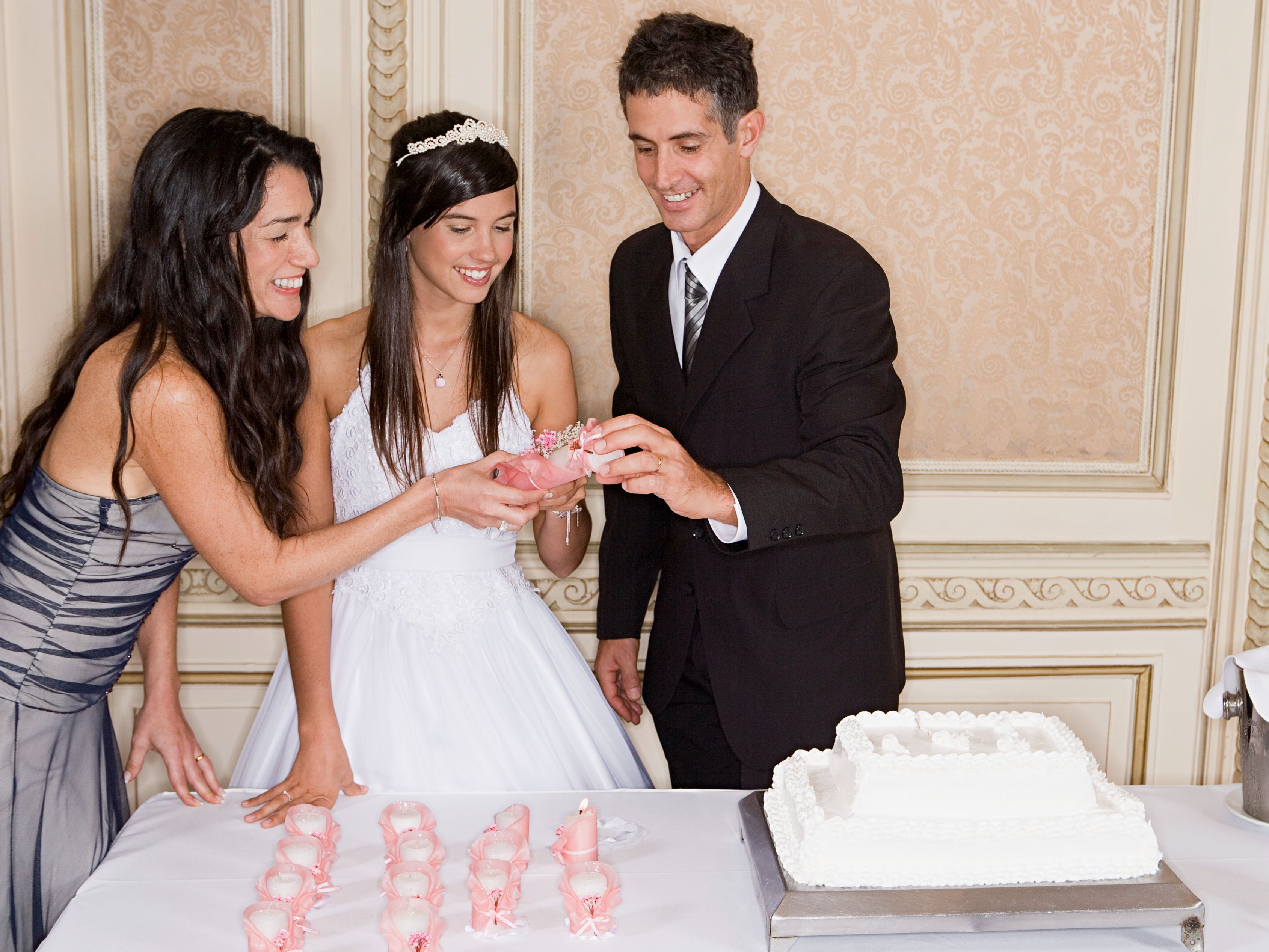 birthday girl and parents at quinceanera