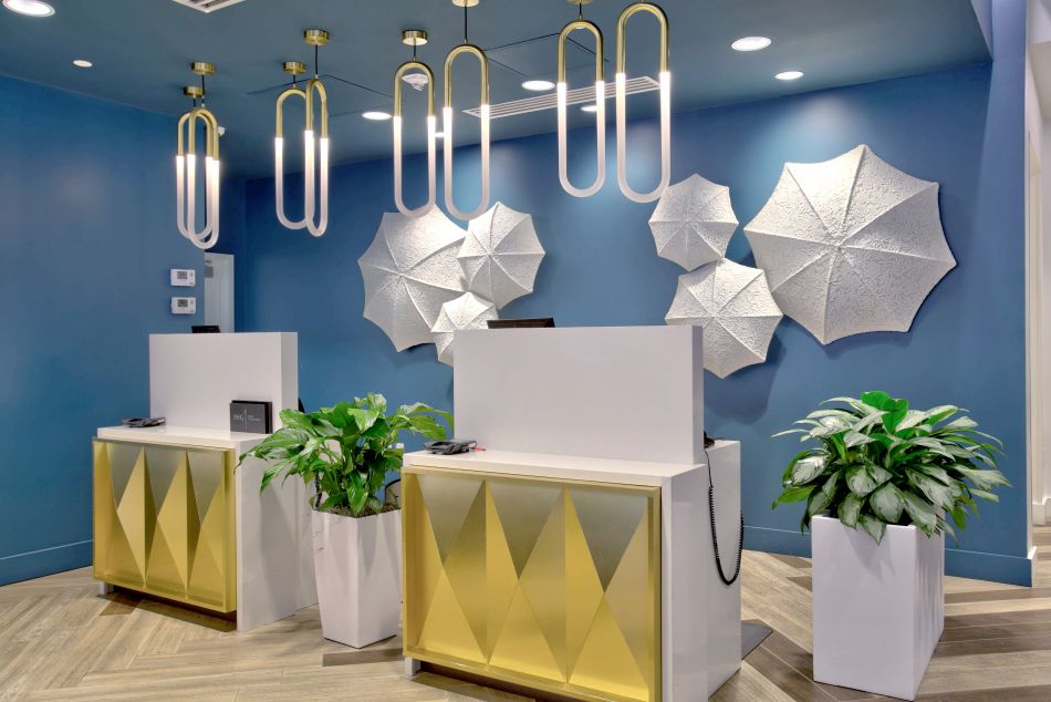 Stunning white umbrella exhibits behind check-in and check-out desk