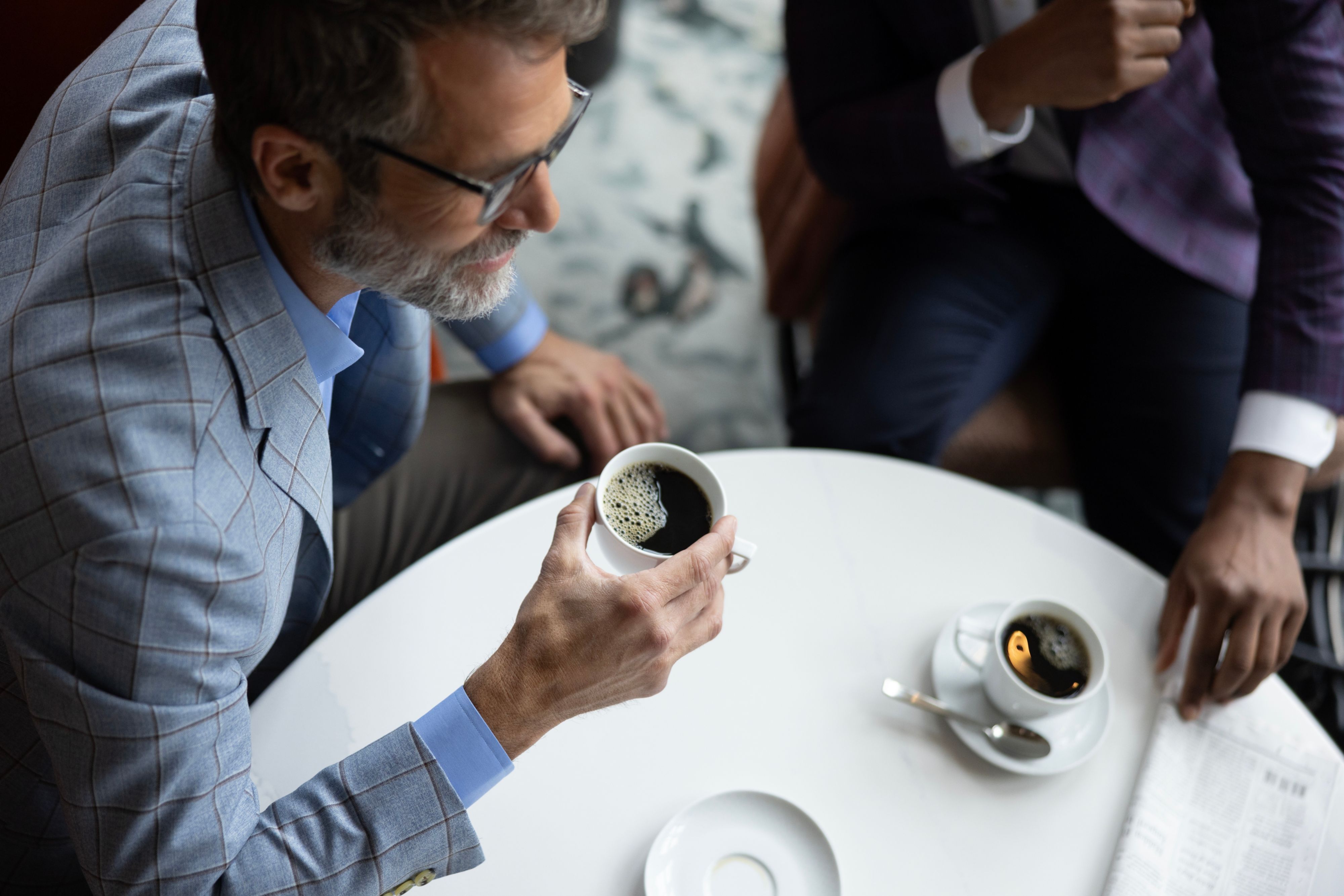 Three people meeting in a public space