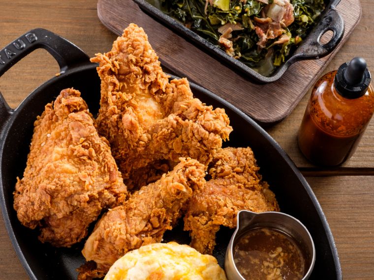 Fried chicken with side of greens and biscuit