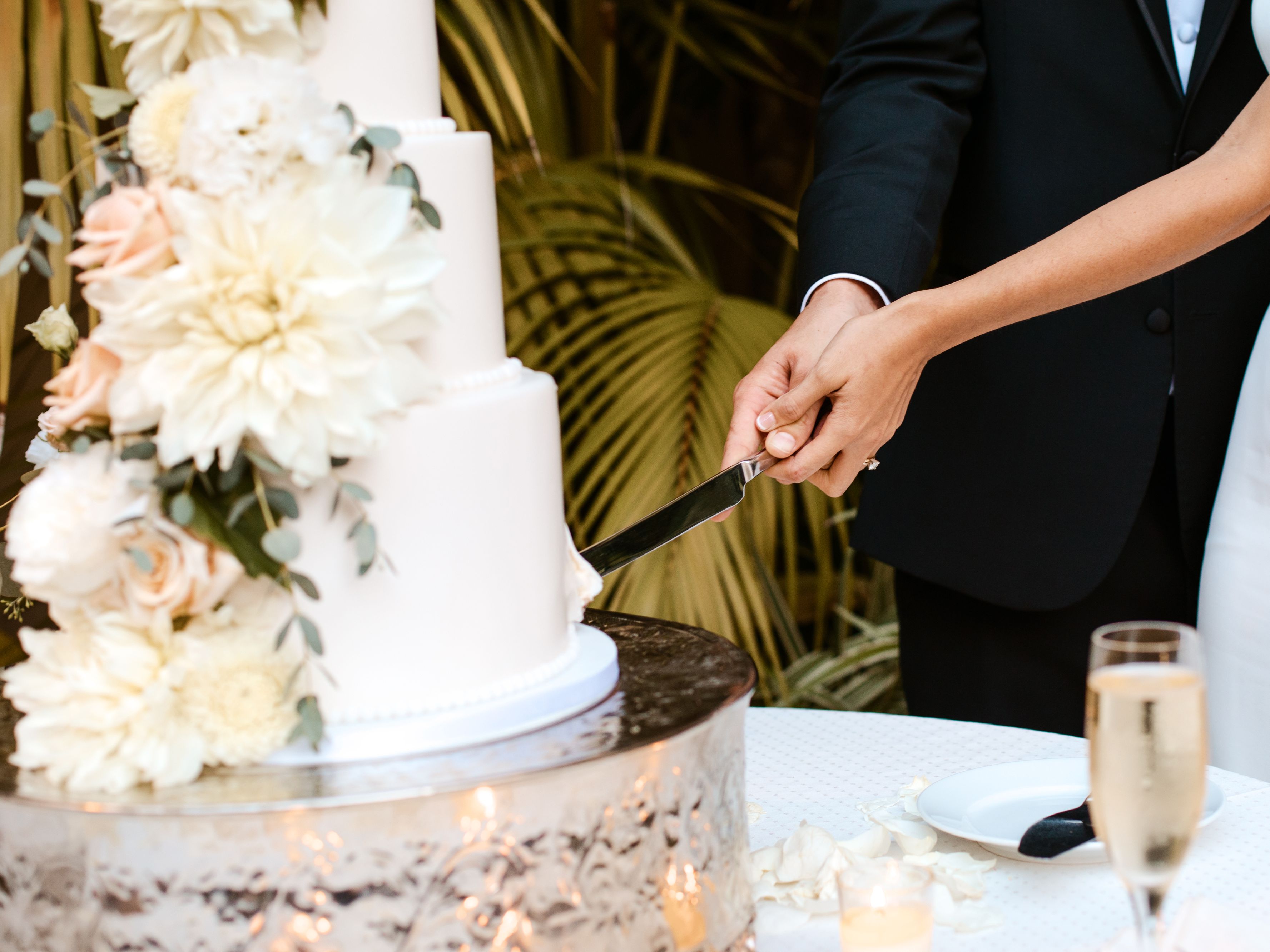 bride and groom cutting wedding cake
