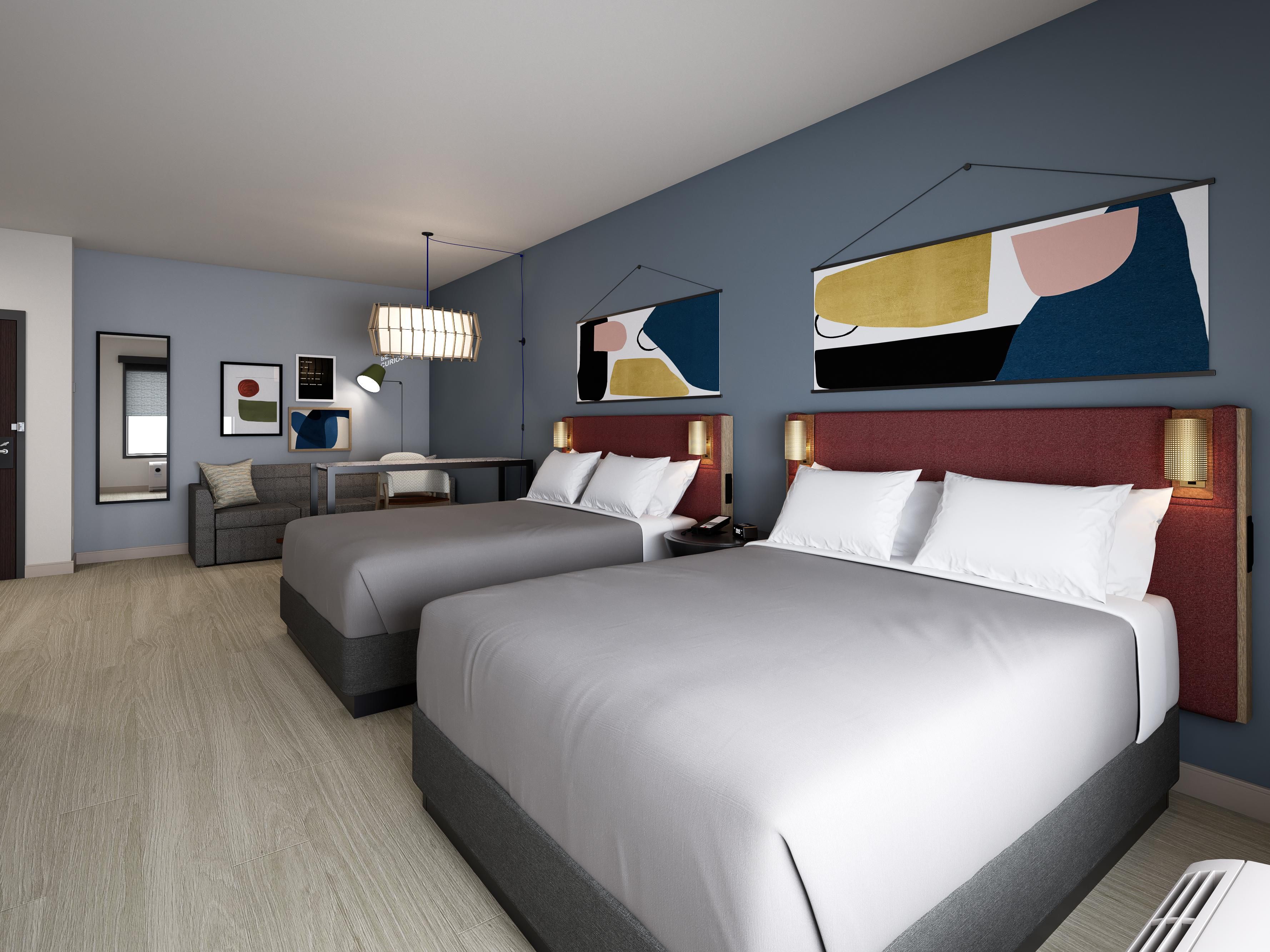 Travel solo or with friends—there's space for everyone! Enjoy your favorite spot in our spacious all-suite rooms featuring a wet bar, cozy lounge, standing desk, and spa-like bathroom. Each suite includes a microwave, refrigerator, and coffee maker, ensuring comfort for short or extended stays with separate areas for living, working, and sleeping.