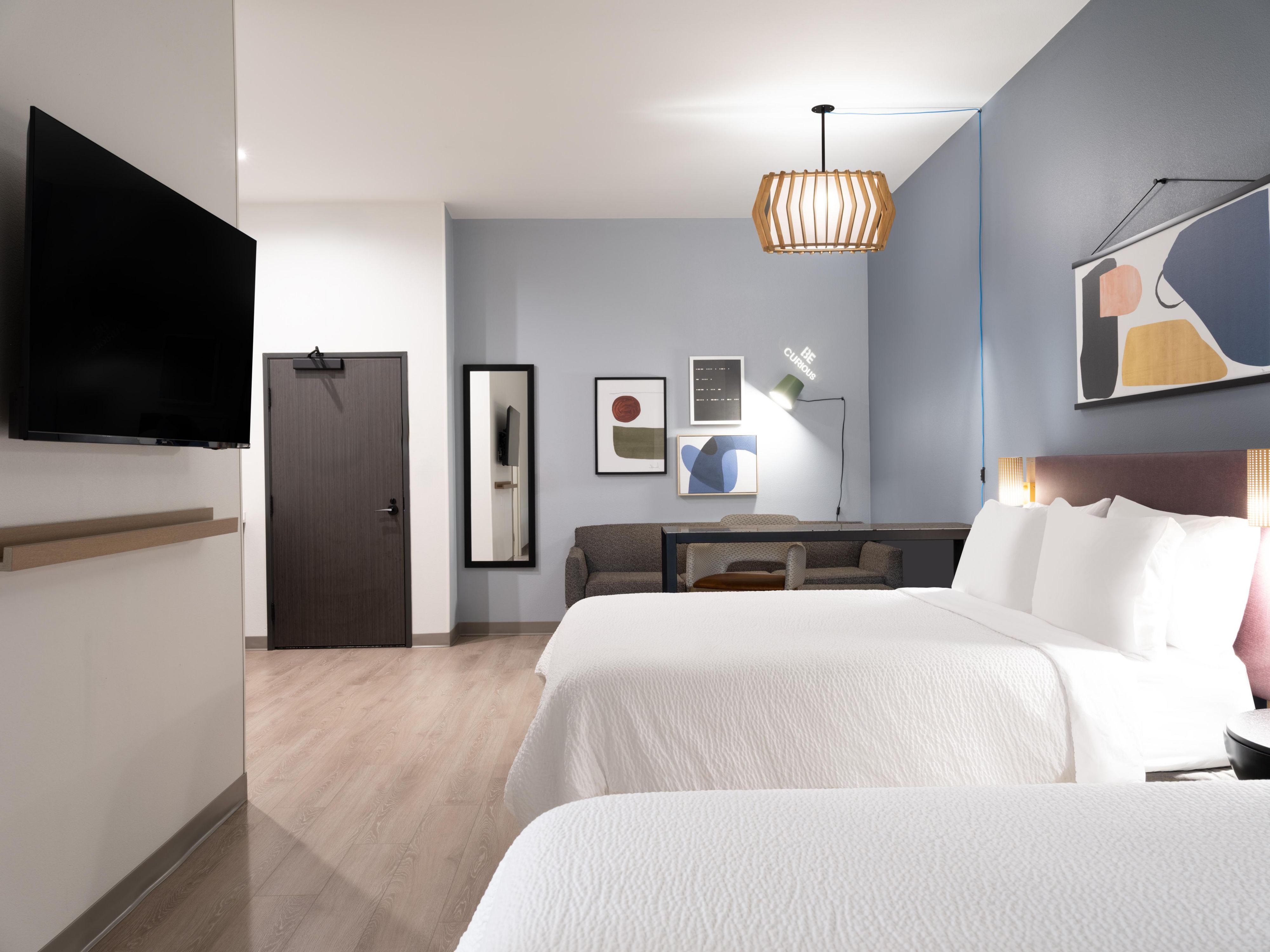 Every room is a spacious suite at our Fort Worth hotel. There’s plenty of room for you to spread out and work, relax, or rest. With a standing desk, comfy bed, private bathroom, wet bar, minifridge, microwave, and coffeemaker, you’ve got everything you need for the perfect stay.