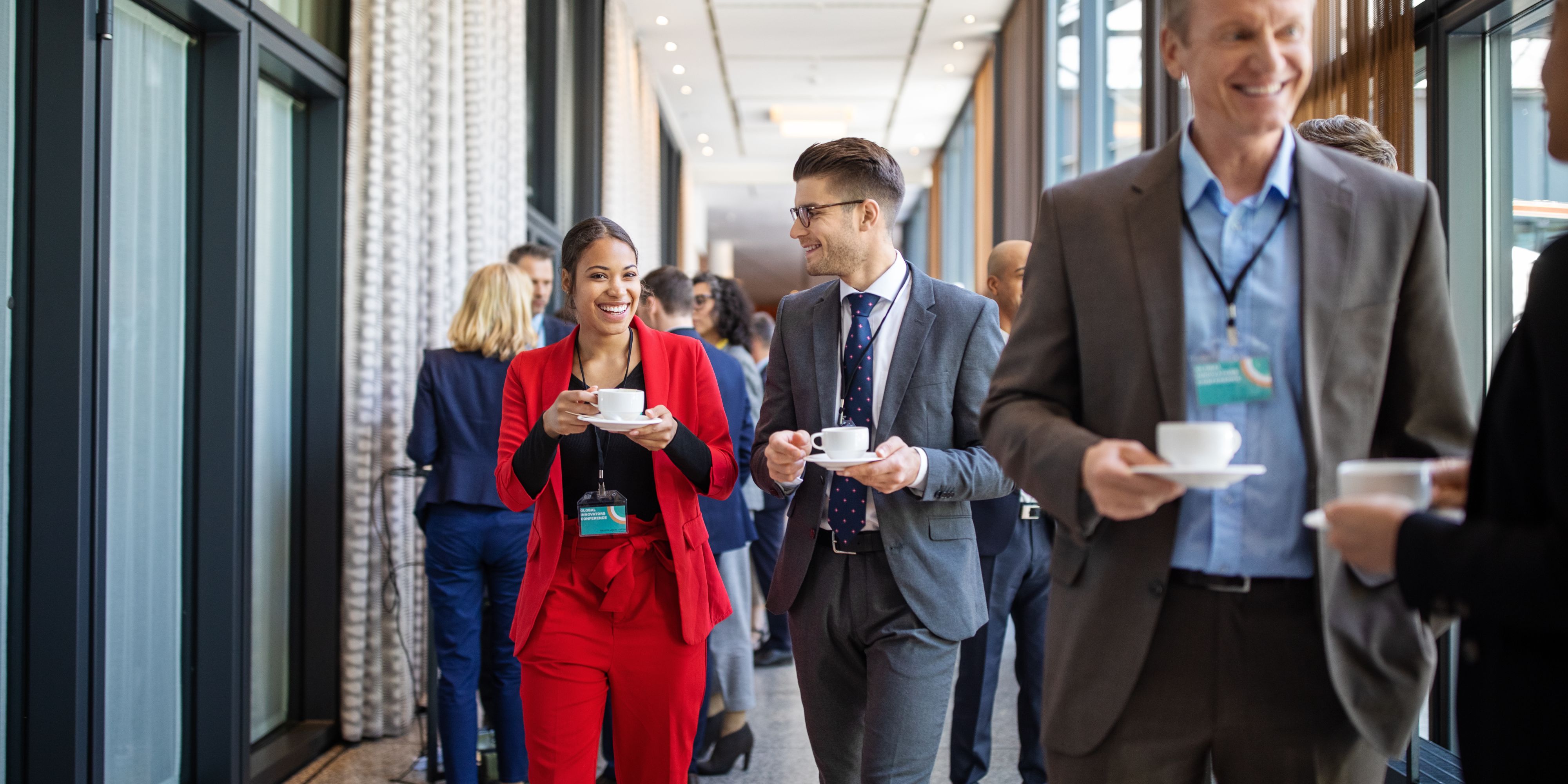 People walking and talking at a conference.