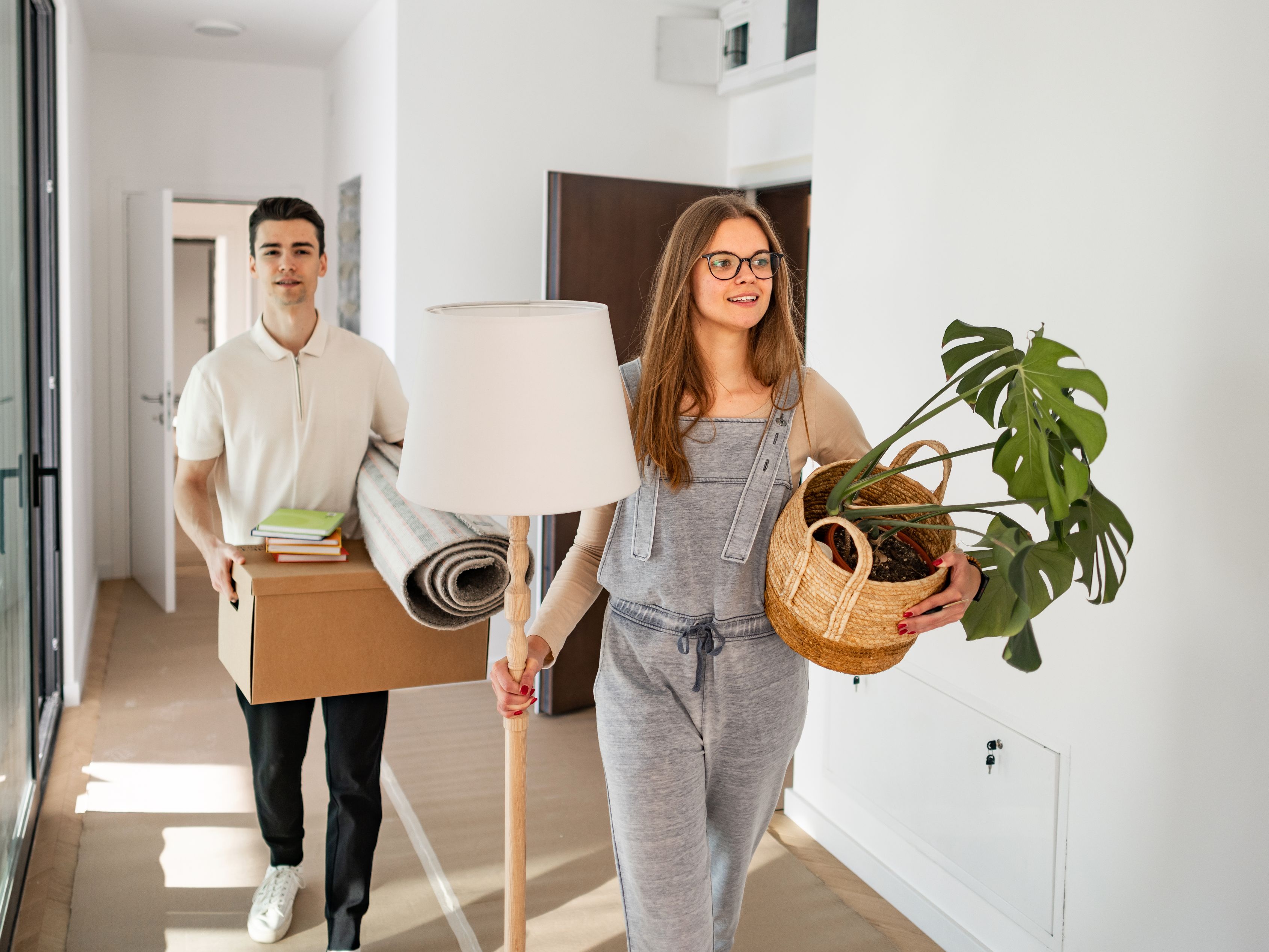 young man and woman moving into a dorm