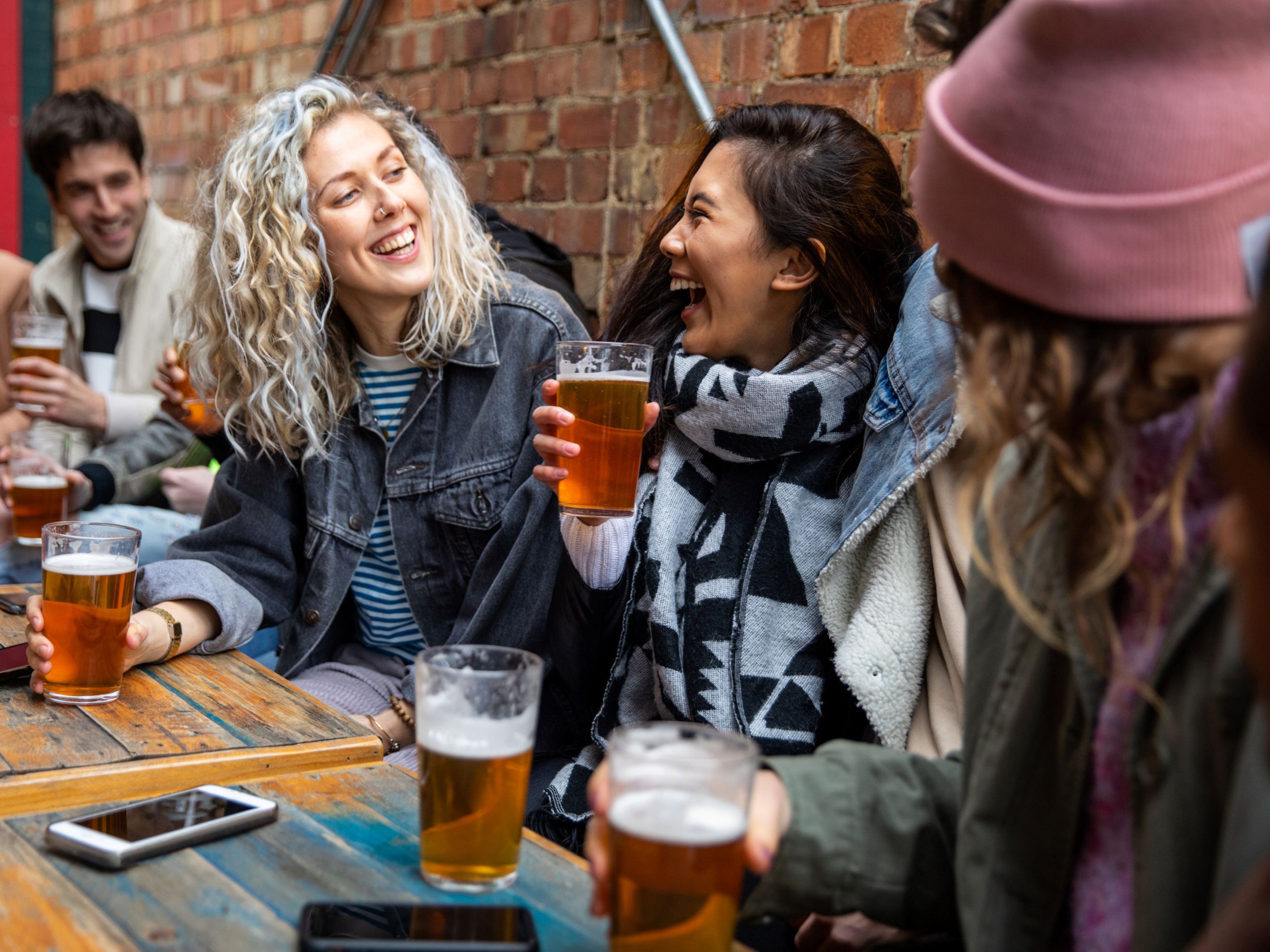 Friends enjoying a beer at an outdoor festival