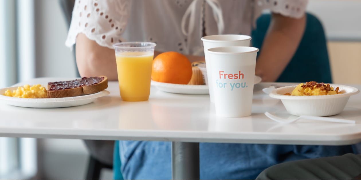 Delicious, hot hotel breakfast laid out on table.