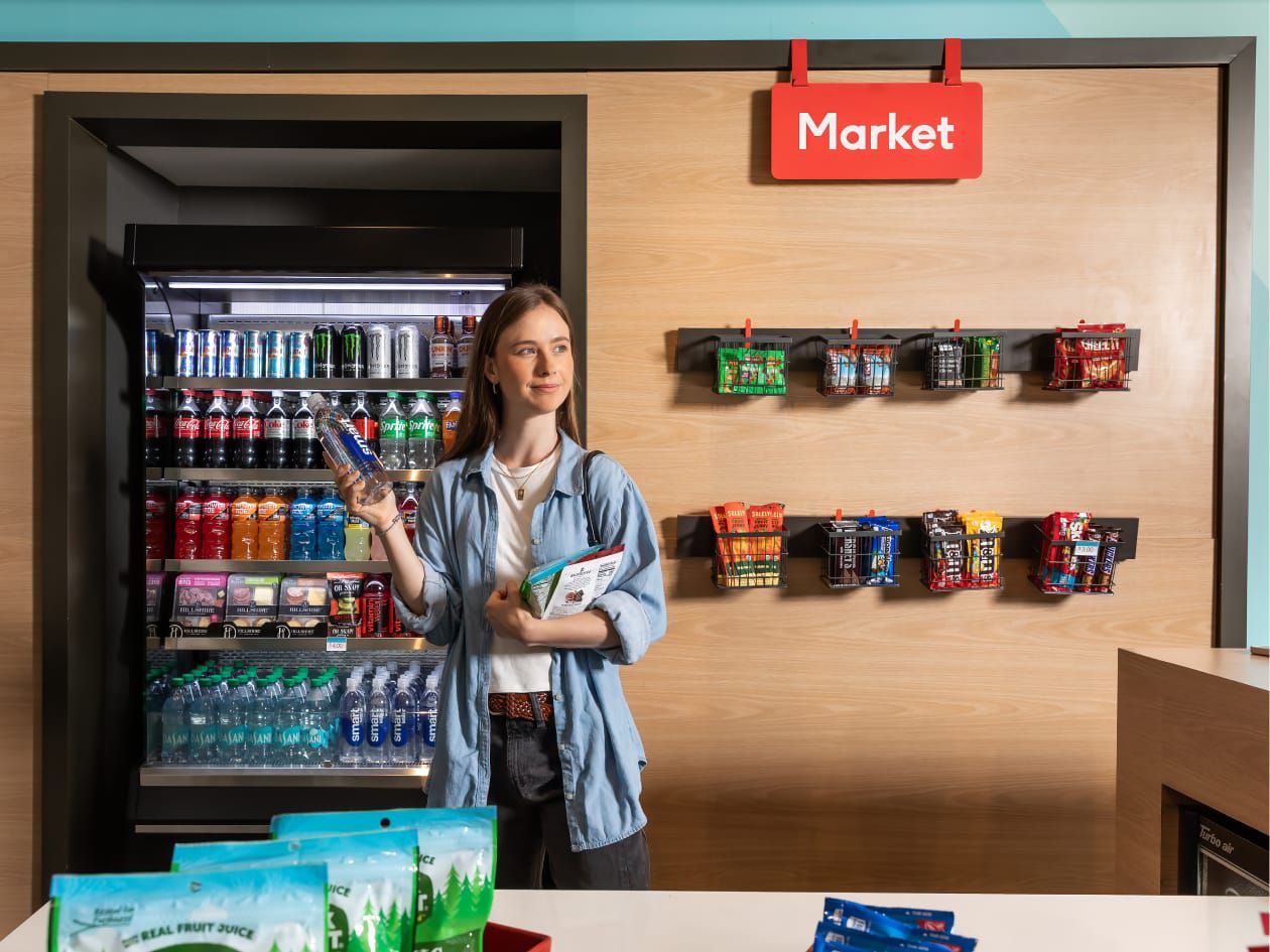 Woman standing with snacks in market area