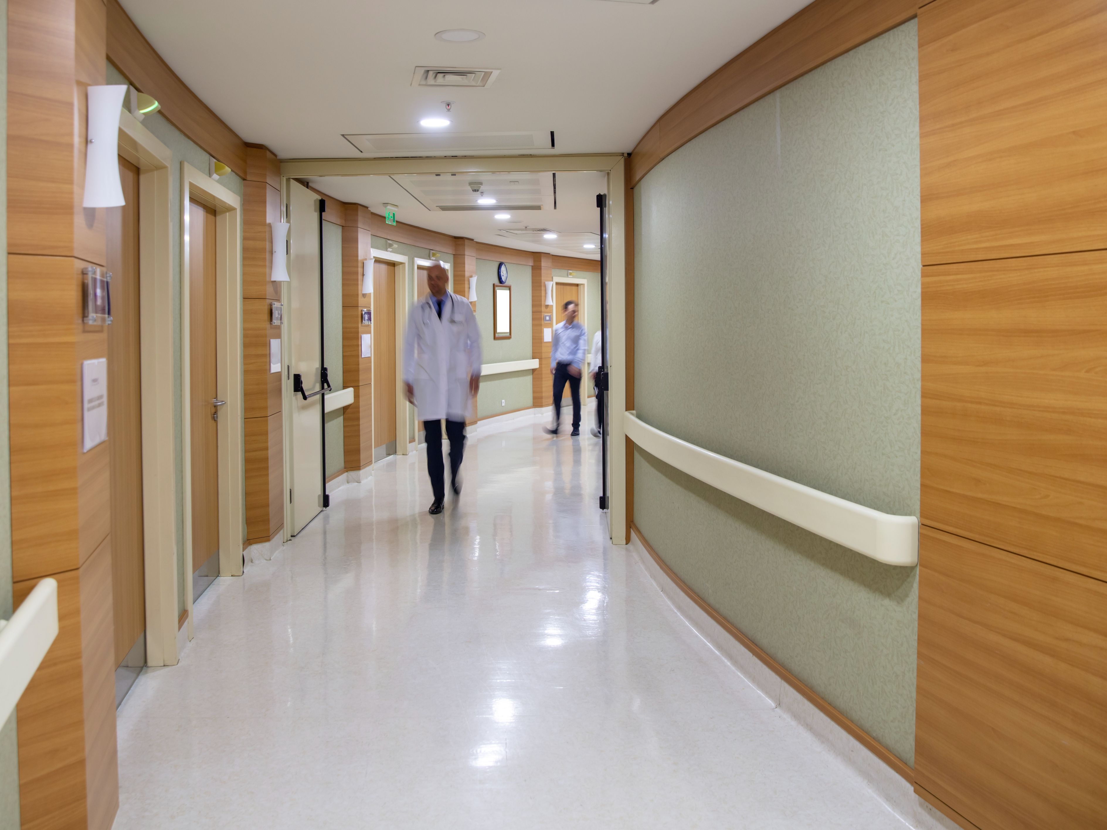 doctors walking down a hospital hallway