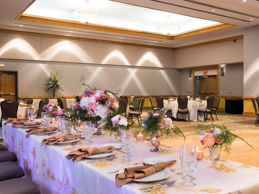 Table setup with wedding bouquet and silverware