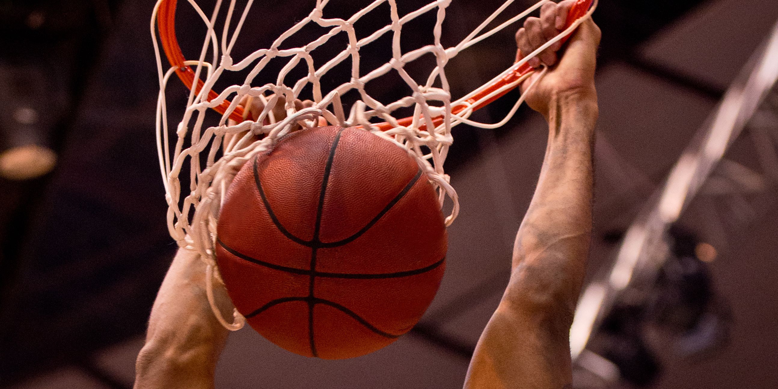Basketball player dunking the ball.