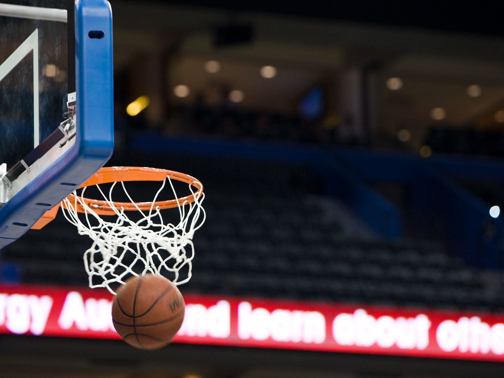 Basketball going through hoop