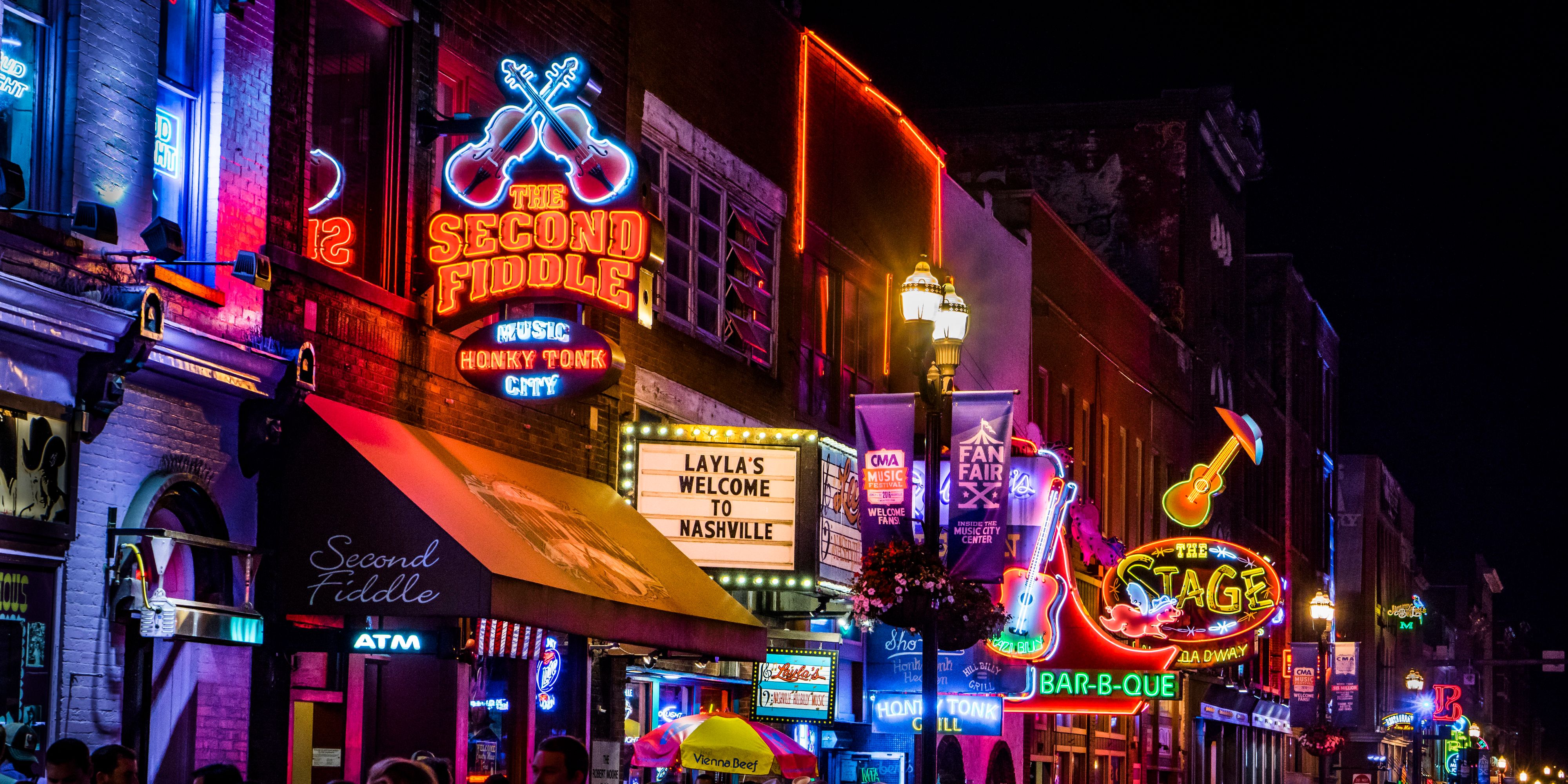 Broadway buildings at night with neon signs