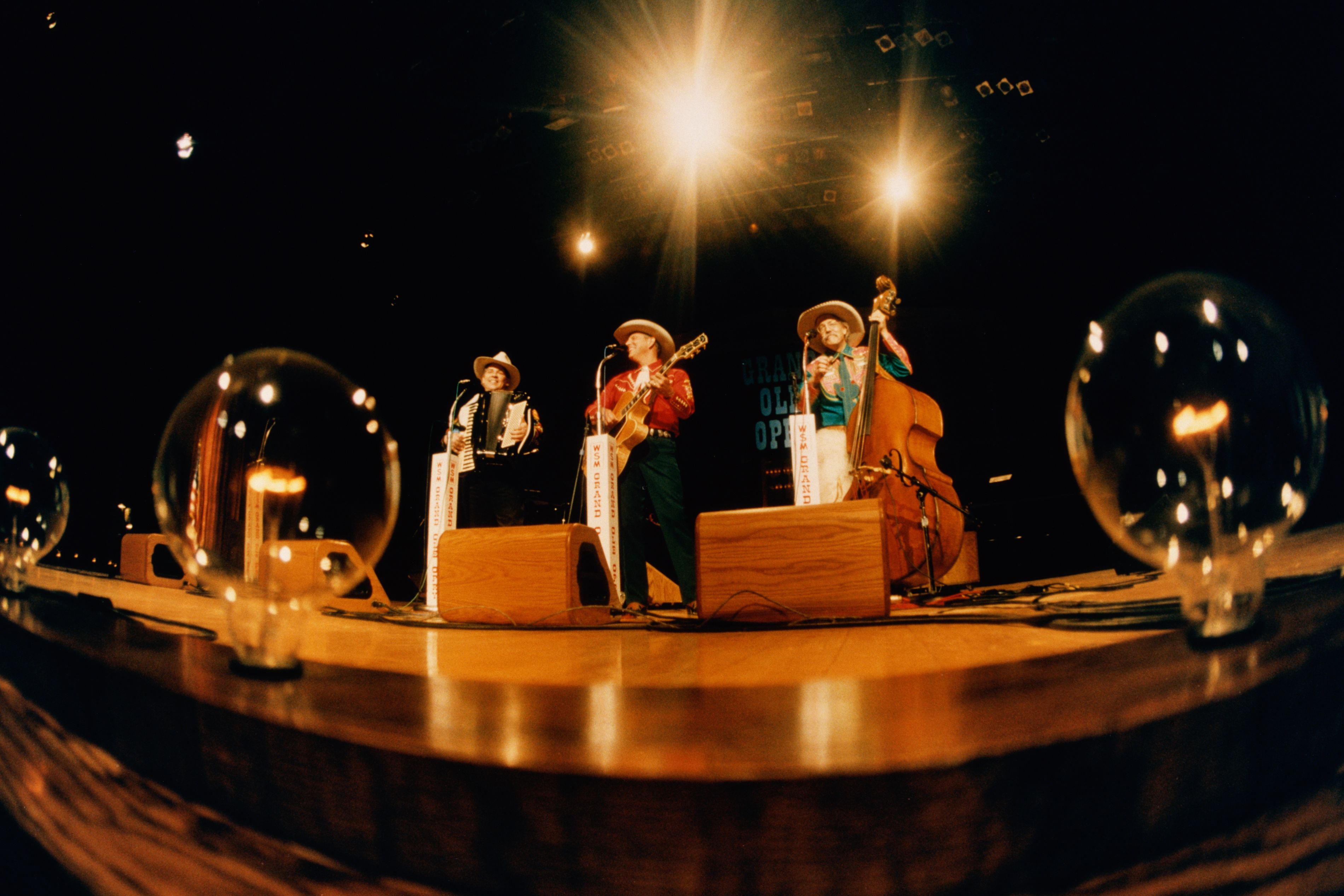 performers on stage at Grand Ole Opry