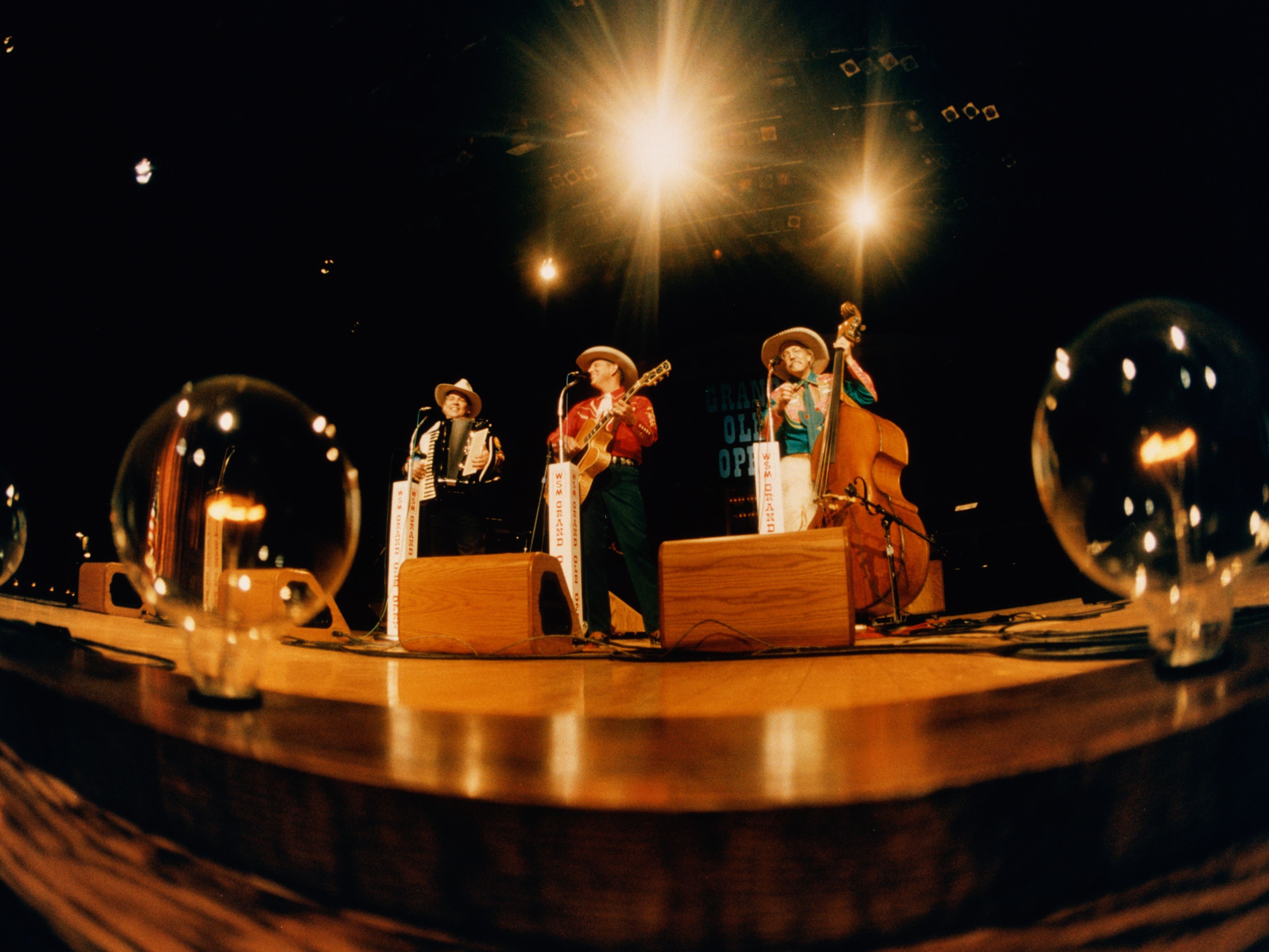 Performers on stage at the Grand Ole Opry