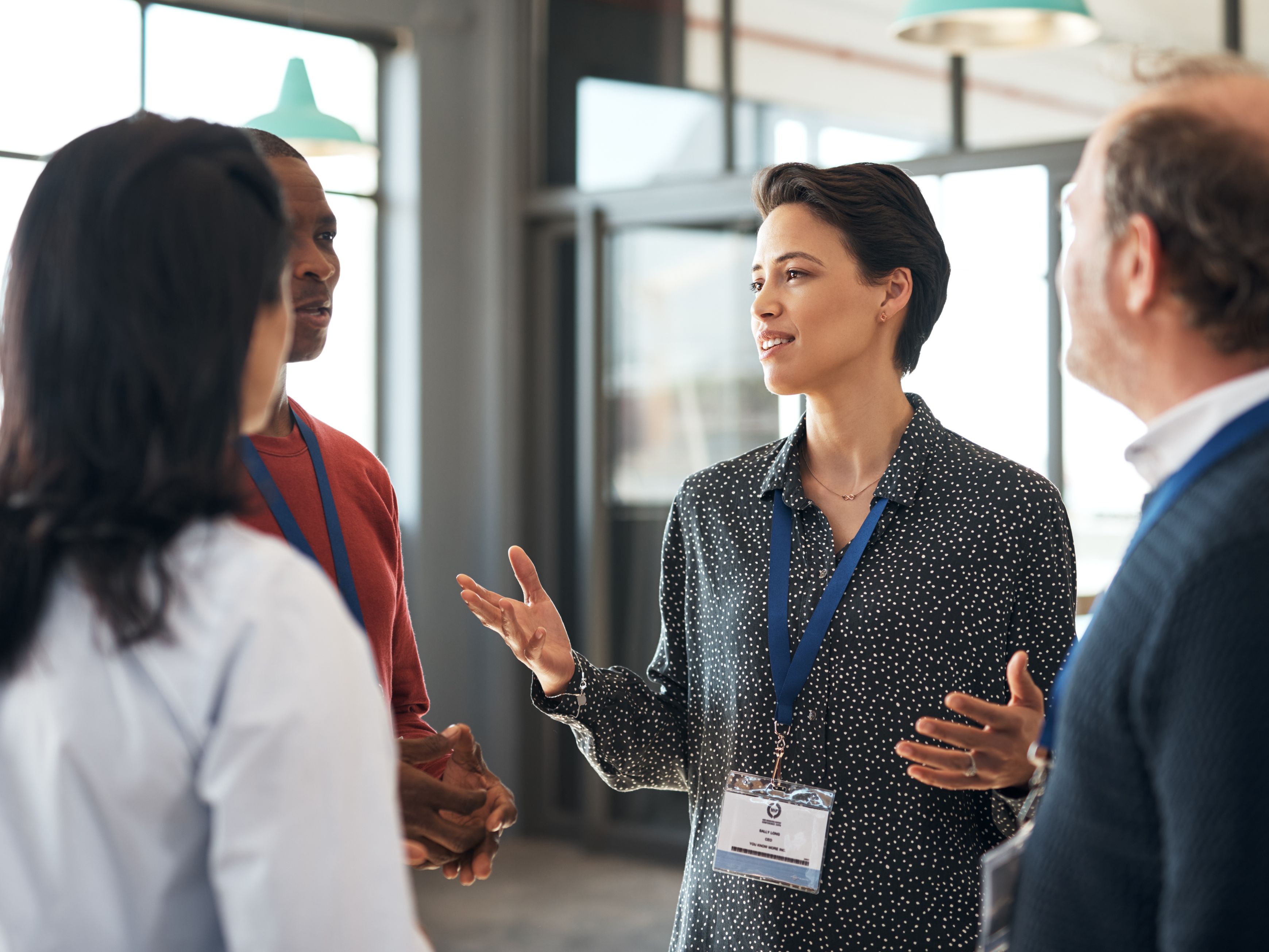 people standing and talking at a business center.