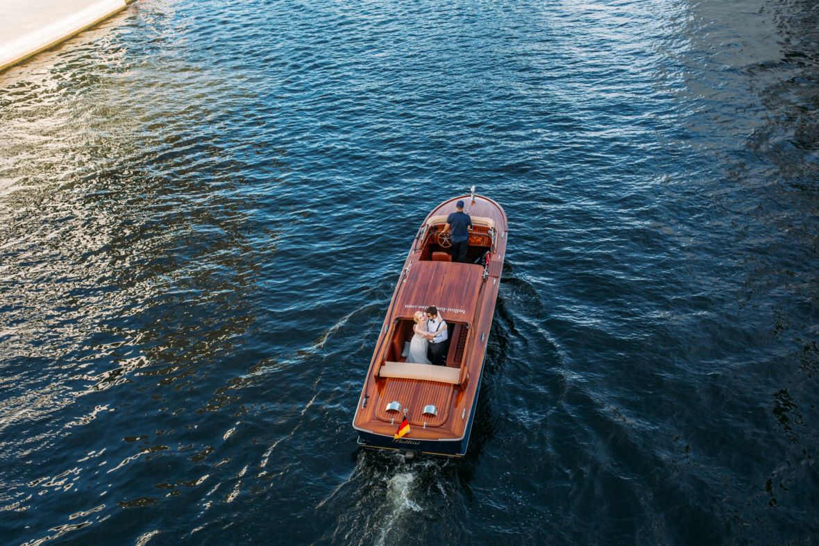 Boat on water with embracing couple
