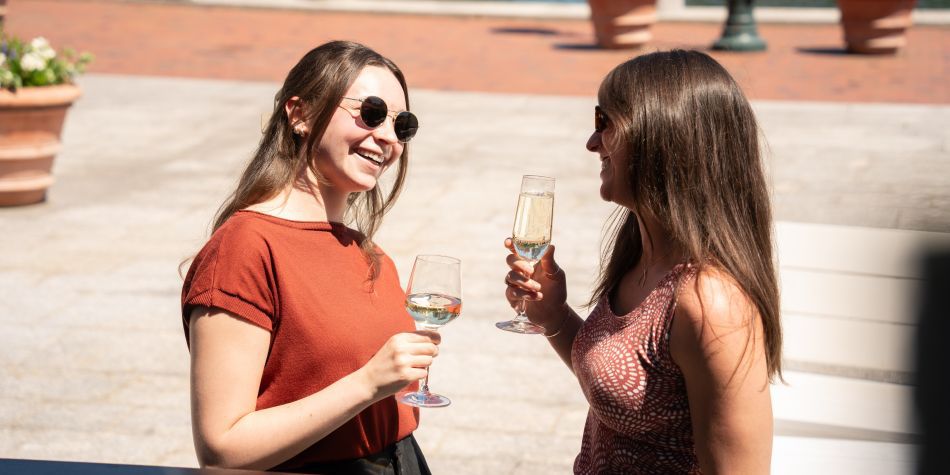Guests talking and enjoying drinks at 510 Waterfront.
