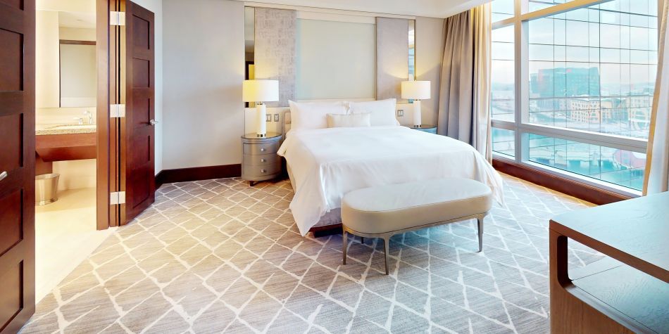 Cozy bed in the Ambassador Suite.