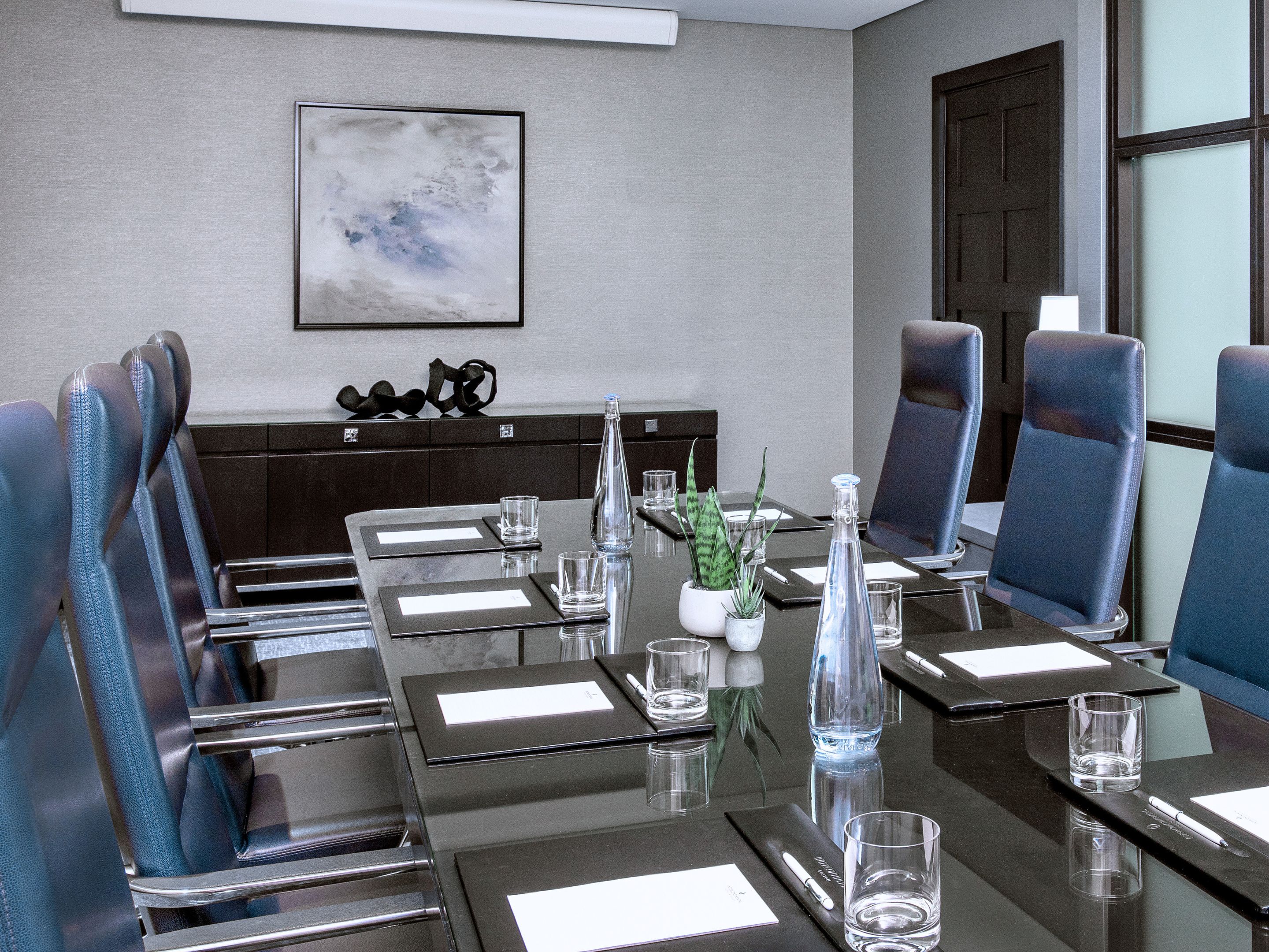 Boardroom with a conference table set up for a meeting.