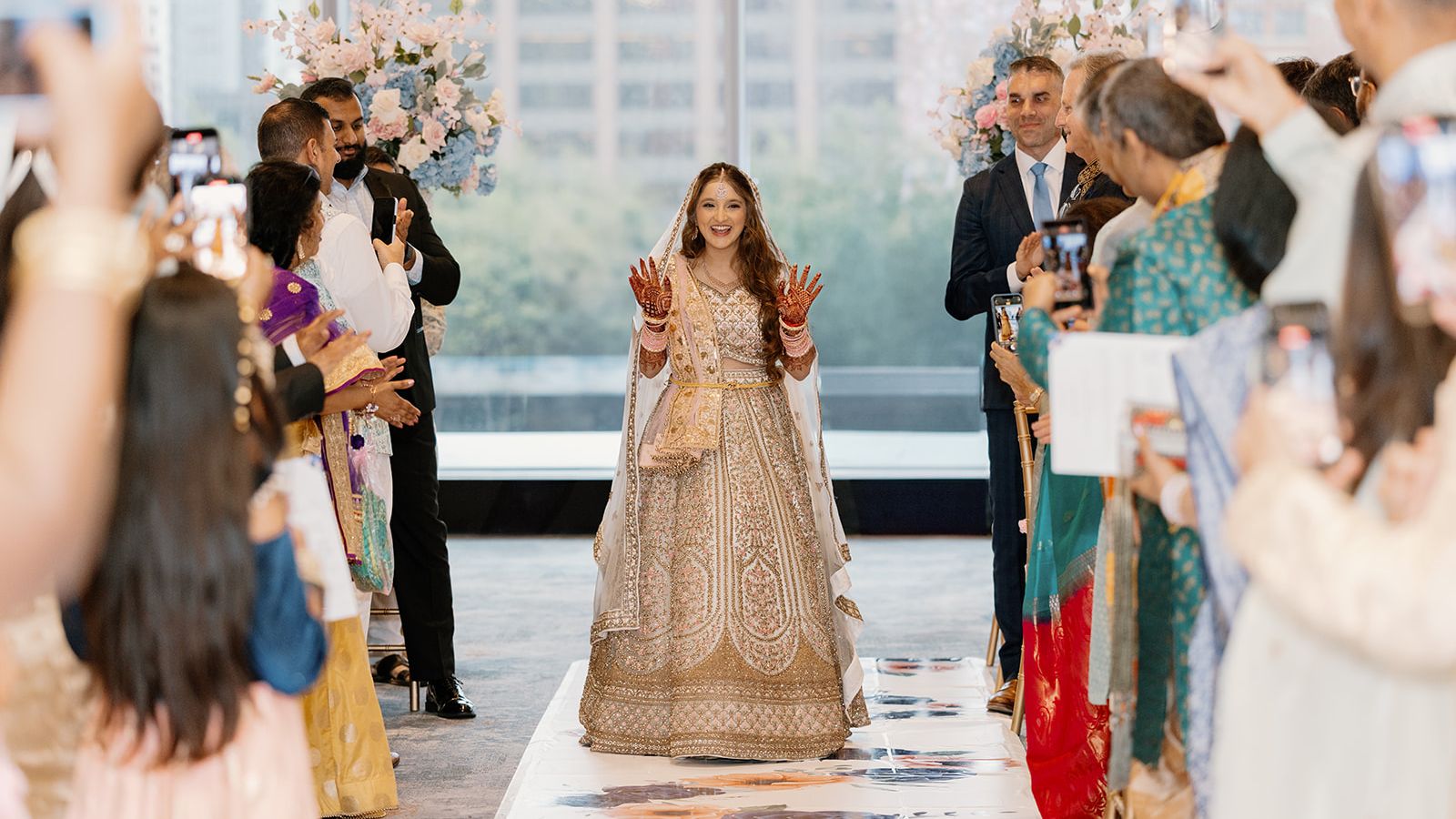 Bride walking down the aisle at an Indian wedding.