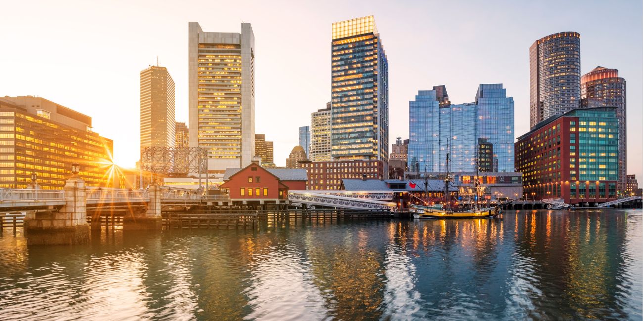 Buildings on the Boston Harbor during sunset. 