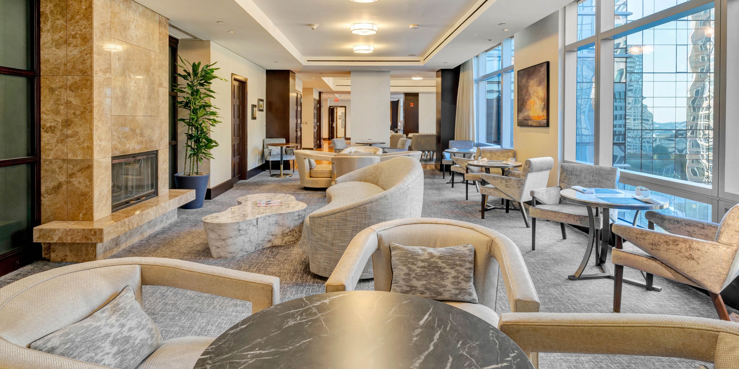 Club InterContinental lounge with fireplace and skyline views.