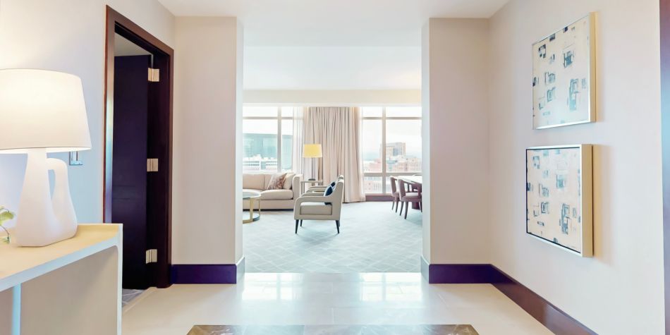 Welcoming Club InterContinental suite entrance leading to a bright living and dining room.