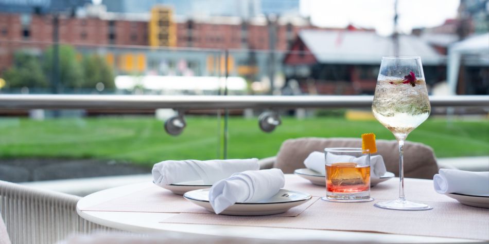 Cocktails on outdoor dining table at IC Boston.