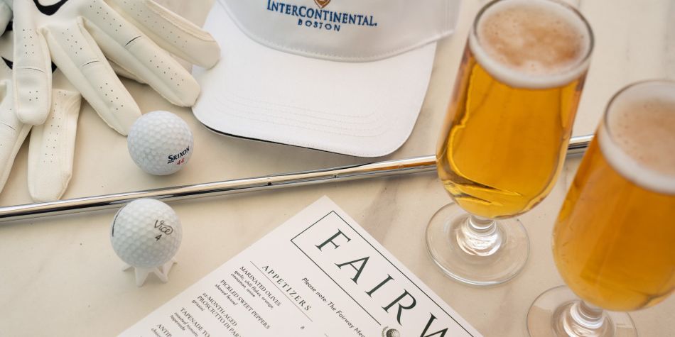 Fairway menu, two cold beers, an IC Boston hat, and a golf club, gloves, and balls.