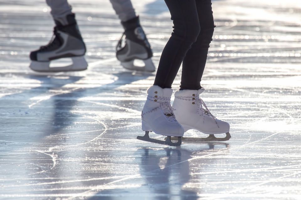 Ice skates on frozen pond.