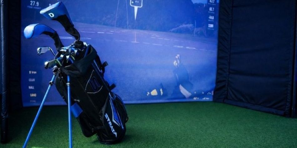Golf bag in front of the simulator.
