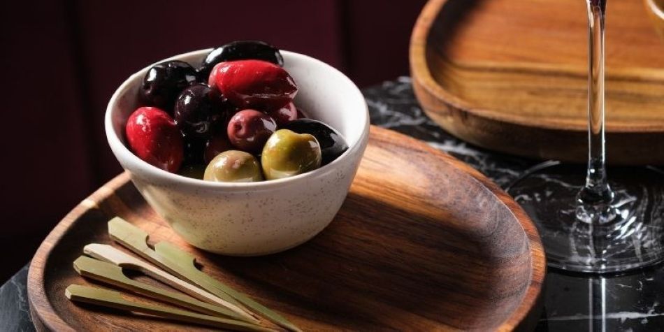 Marinated olives on a tray.