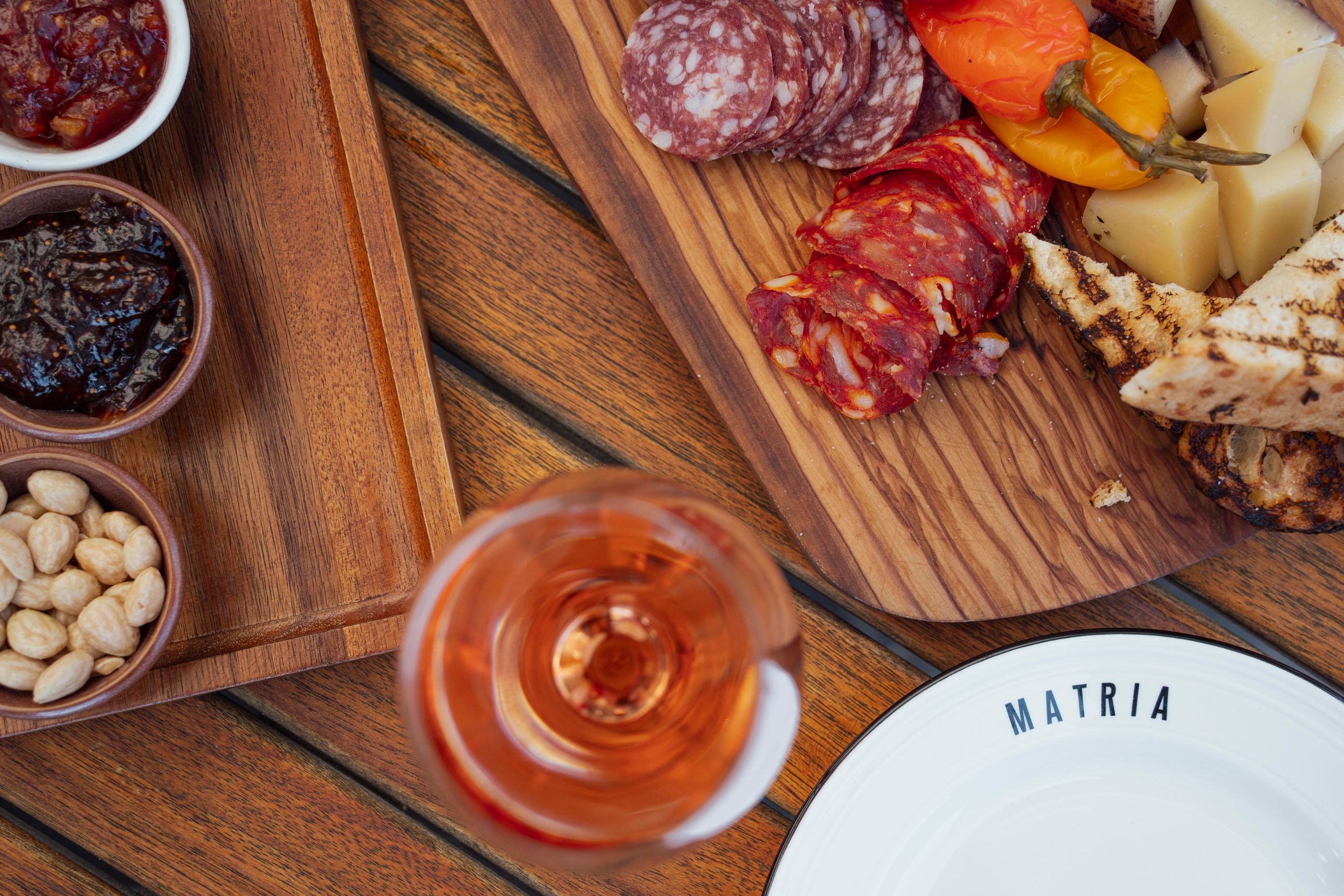 Charcuterie board with cured meats and rosé at Matria.