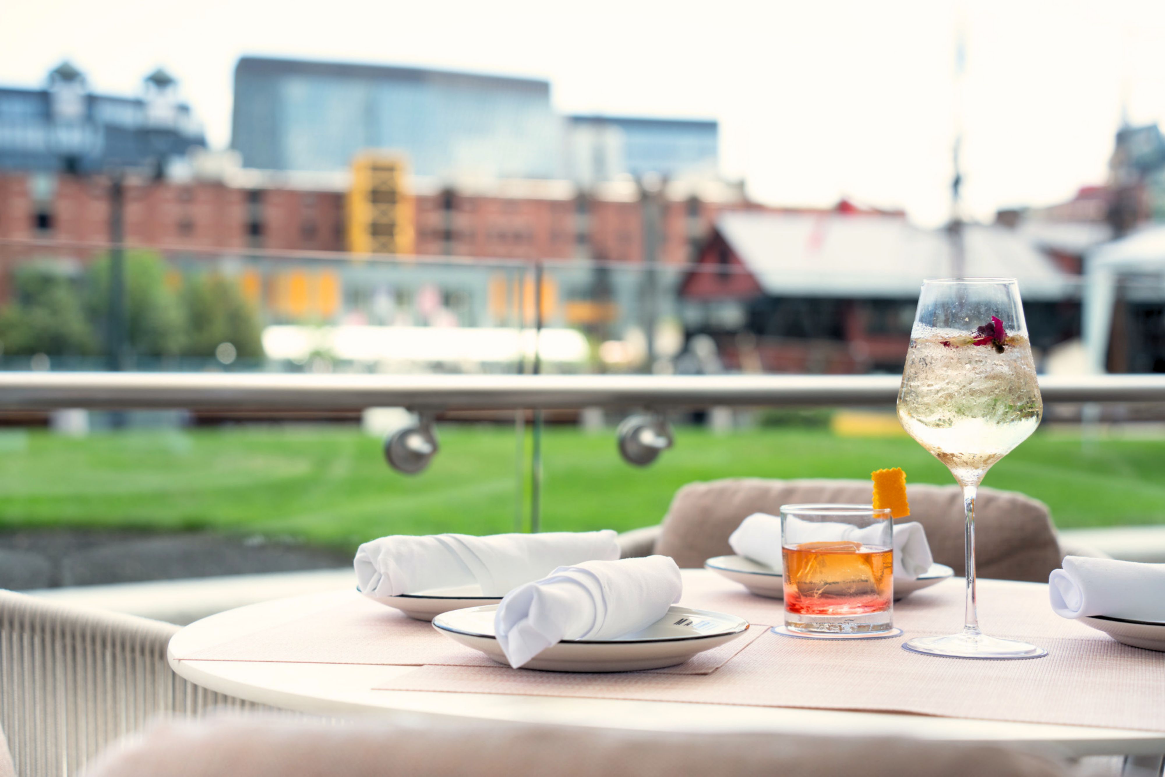 Craft cocktails on an outdoor Boston waterfront patio.