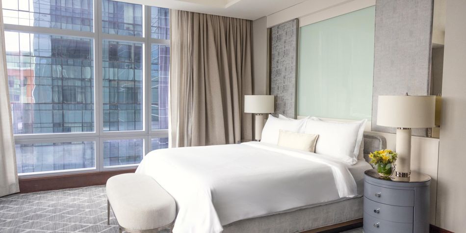 Penthouse suite bedroom with Boston skyline view