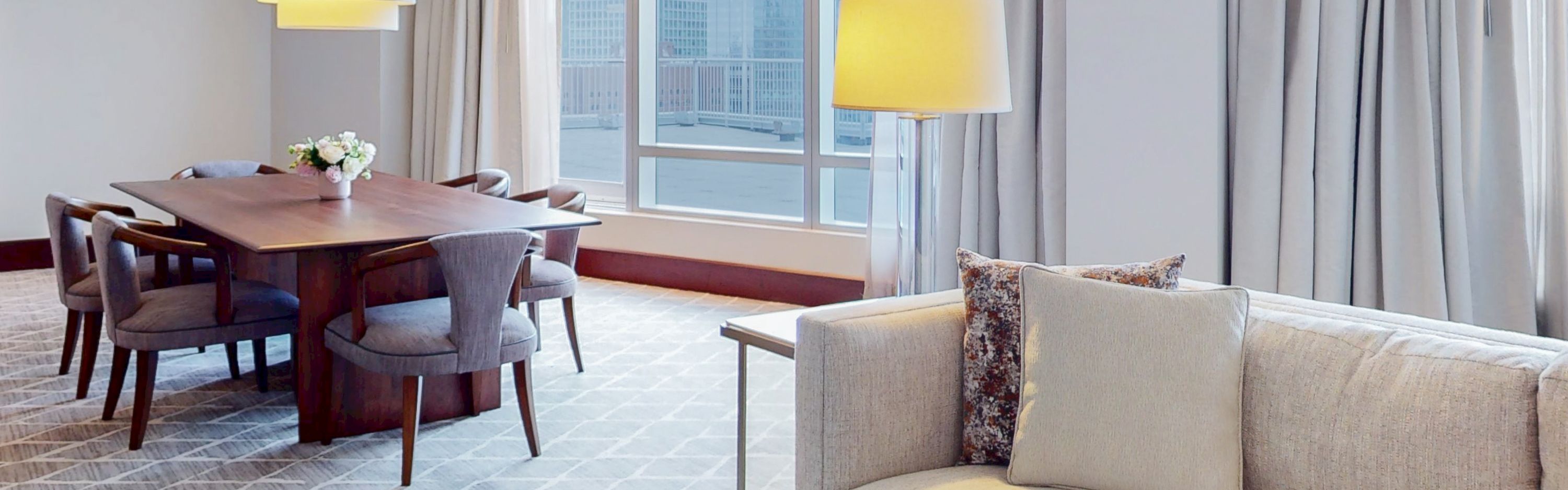 Penthouse South Suite living and dining with city view
