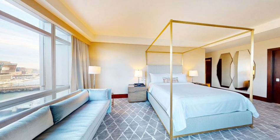 Presidential Suite king bedroom with canopy and city view