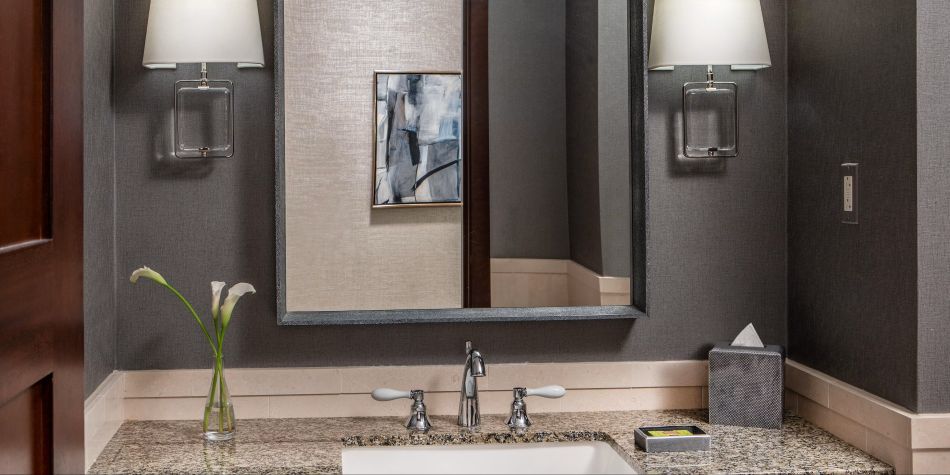 Presidential Suite bathroom vanity with granite countertop
