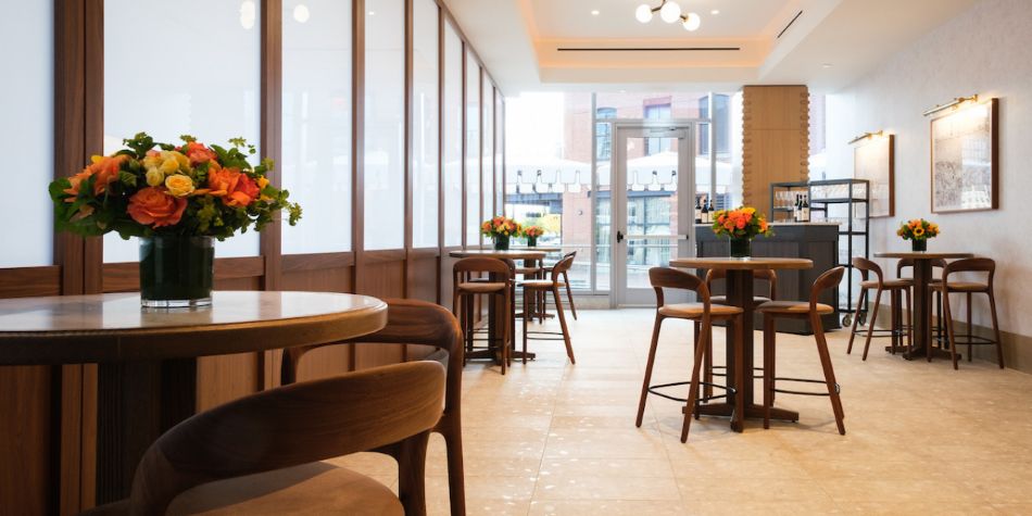 Private dining room with warm floral centerpieces.