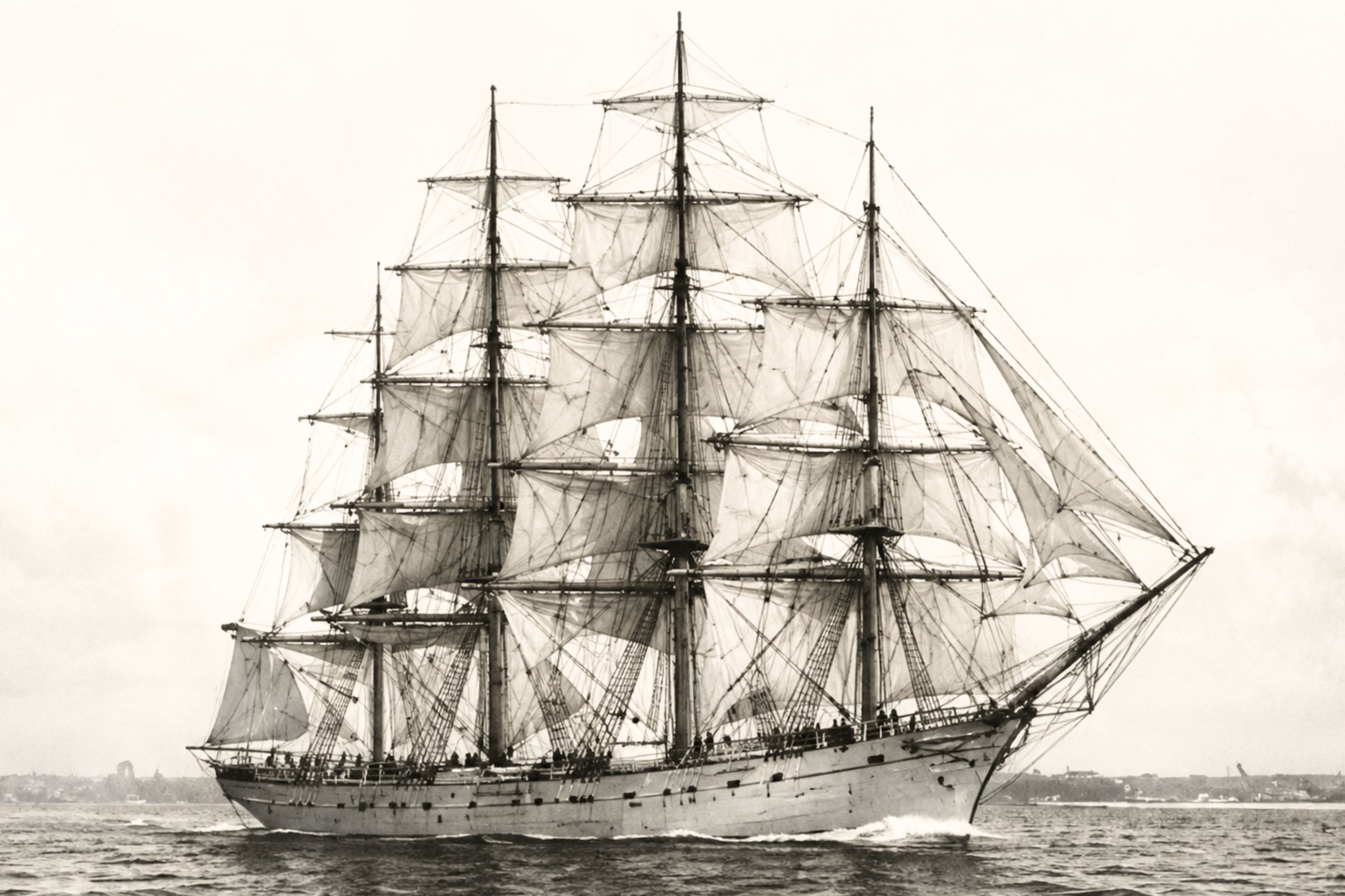 Historic four-masted sailing ship on Boston Harbor, vintage photo.