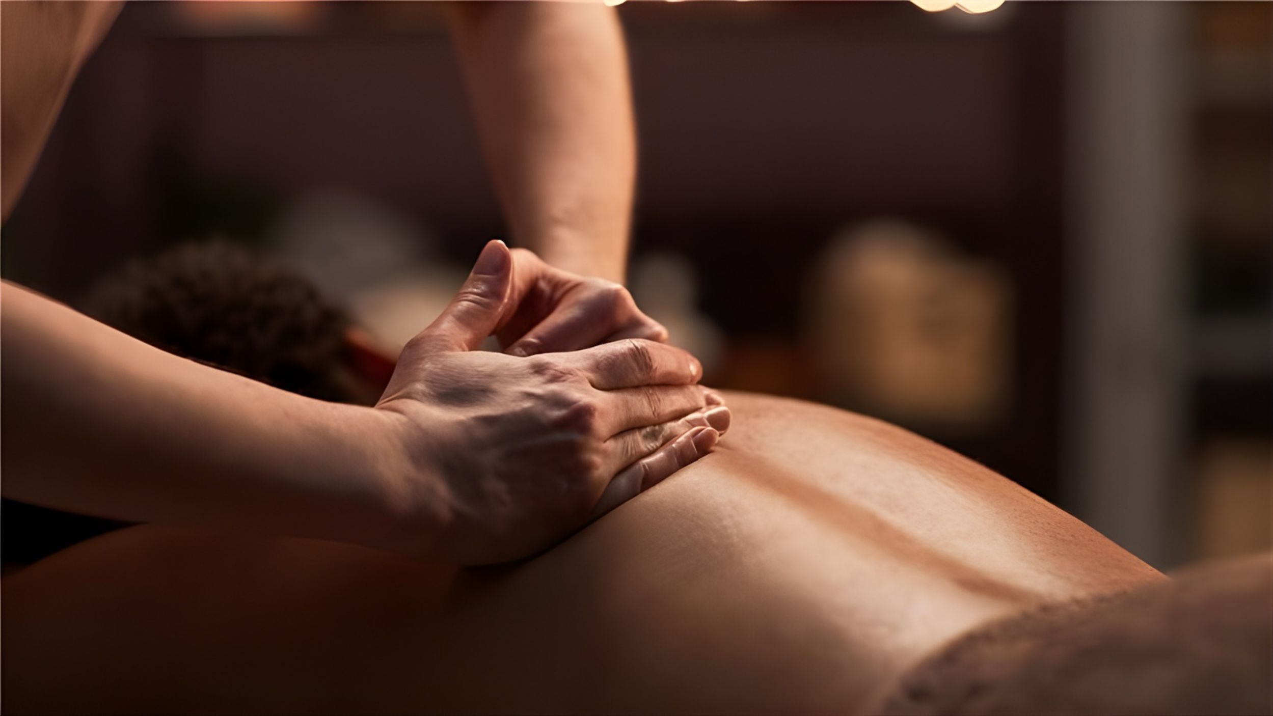 Guest receiving a massage at the spa.