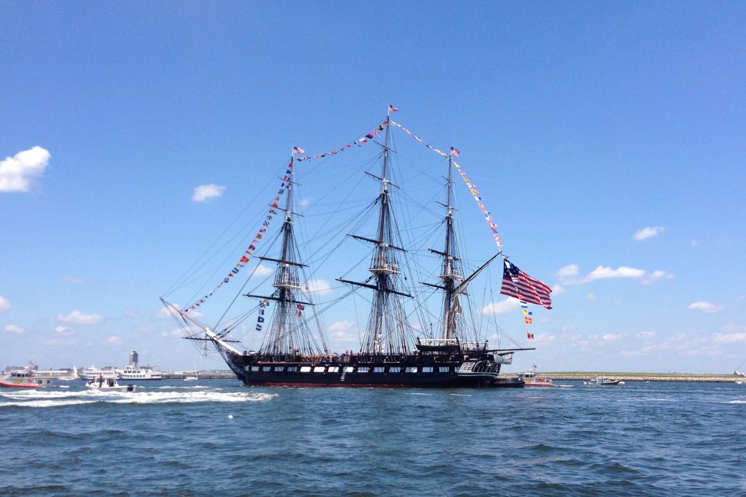 Tall historic ship in Boston Harbor.