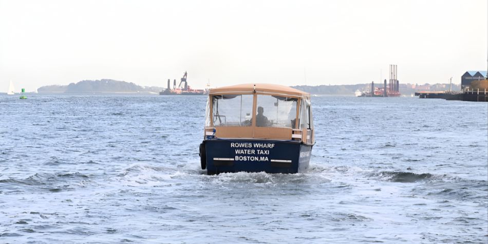 Water taxi driving through the harbor. 
